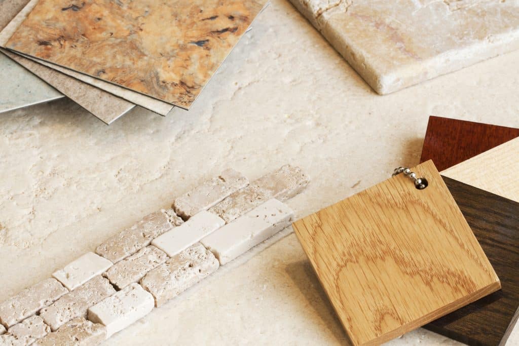 Sample wall and floor coverings alongside some sample swatches of wood for bathroom furniture.