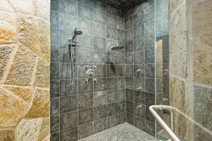 bathroom renovation with gray shower tile